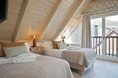 Llit o llits en una habitació de Luderna - Dúplex Moncasan