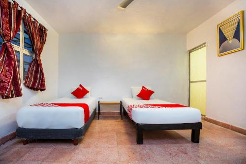 En eller flere senger på et rom på Casa Cuevas & Amaro