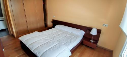 Postel nebo postele na pokoji v ubytování HOLIDAY HOMES by del abuelo VEGADEO
