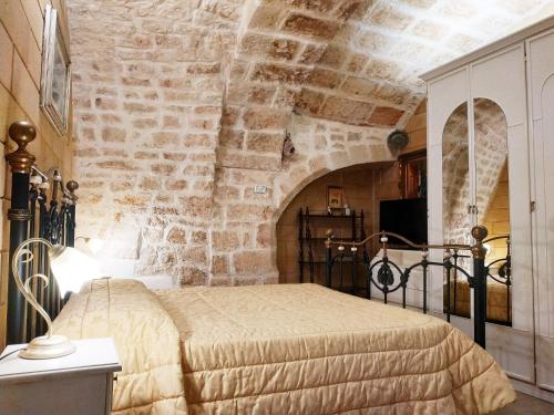 Un pat sau paturi într-o cameră la Fascino Antico