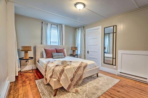 a bedroom with a large bed and a window at Cozy-Chic Attleboro Apt 1 Mi to Dining and Zoo in Attleboro