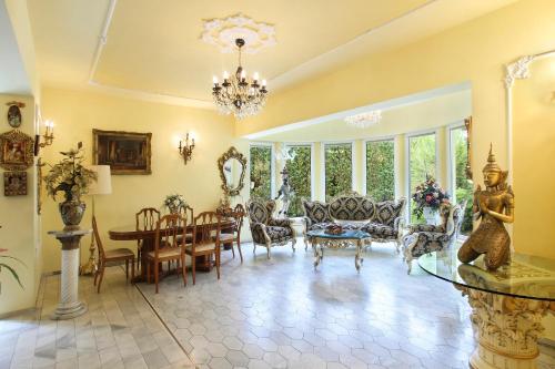 a large living room with a table and chairs at Hotel Panorama in Mosonmagyaróvár