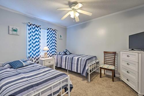 A bed or beds in a room at Coastal Gulf Shores Condo - 1 Block to Beach!