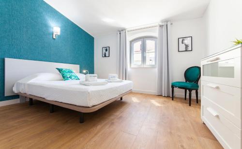Ένα ή περισσότερα κρεβάτια σε δωμάτιο στο Casa Feliz in Lagos