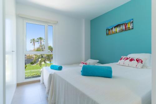 A bed or beds in a room at Villa Flamencos Rosas, Costa Adeje