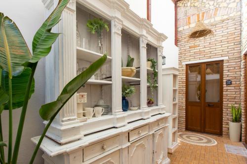 a large white hutch with plants in it at Maison Garibaldi in Cagliari