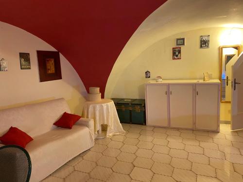 a bedroom with a bed and a table in a room at Antica Casa Centro in Catania