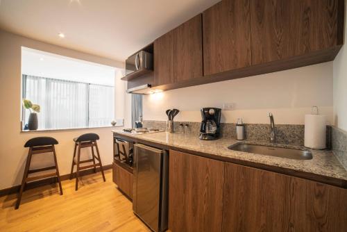a kitchen with a sink and a counter top at Cali River Suites by Yellowkey Capital in Cali