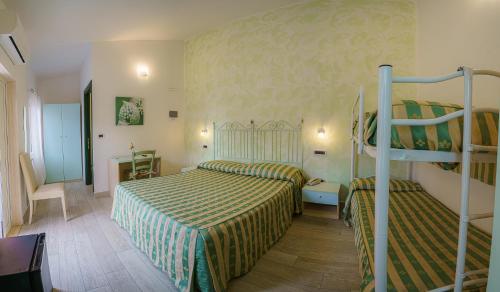 Cama ou camas em um quarto em Albergo La Lampara