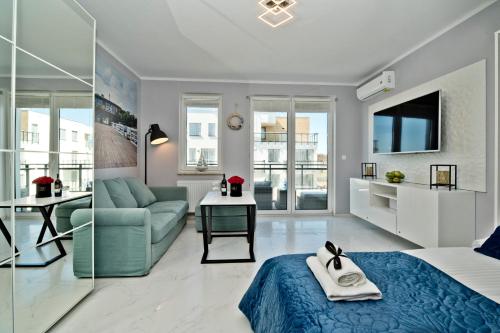 Telewizja i/lub zestaw kina domowego w obiekcie BlueApart Apartamenty Nexo