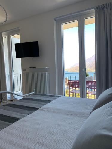 a bedroom with a bed with a view of the ocean at Bregagno B&B in Musso