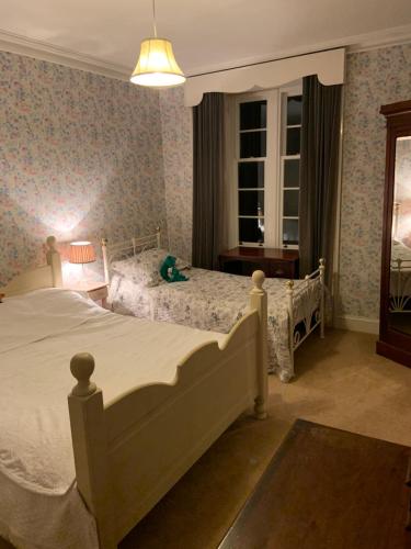 a bedroom with a large white bed in a room at The Law House in Coldingham