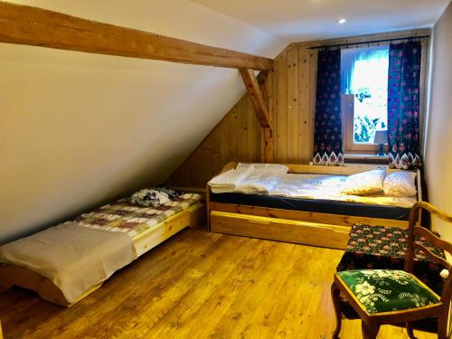 Postel nebo postele na pokoji v ubytování Chata Górala Centralny Szczyrk