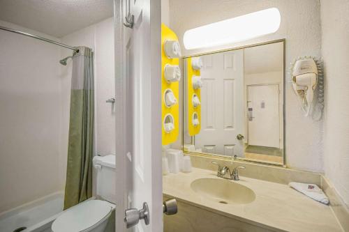 a bathroom with a sink and a toilet and a mirror at Motel 6-North Ridgeville, OH - Cleveland Intl Airport - N Ridgeville in North Ridgeville