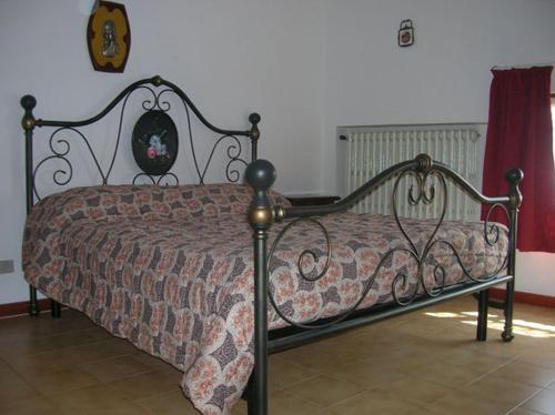 Een bed of bedden in een kamer bij La Magnolia - Fano