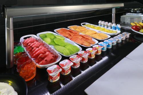 a buffet with many different types of fruits and vegetables at Crowne Plaza Leon by IHG in León