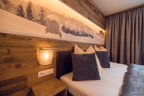 A bed or beds in a room at Chalet Arena