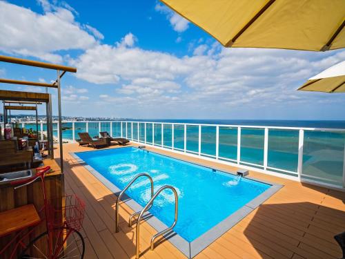 a swimming pool on the deck of a cruise ship at oile by DSH Resorts in Chatan