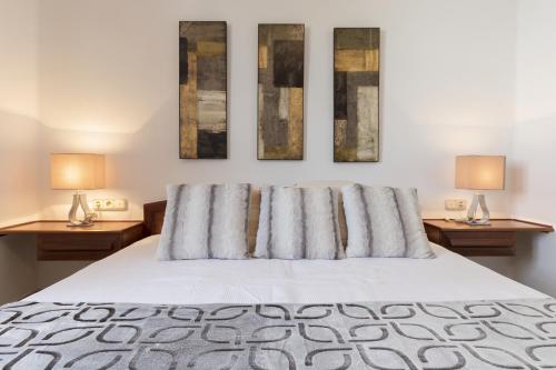 En eller flere senge i et værelse på Casa Marta