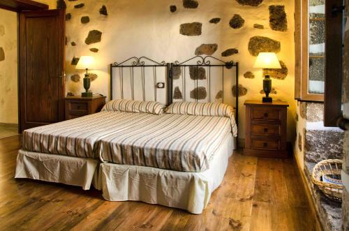 Tempat tidur dalam kamar di Casa Los Olivos