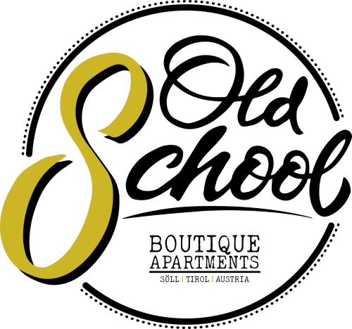 a label for old chooser boutique apartments with their logo at Boutique Apartments OLD SCHOOL in Söll