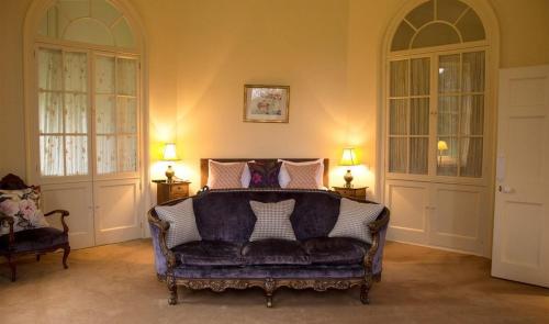 A bed or beds in a room at The Ickworth Hotel And Apartments- A Luxury Family Hotel 