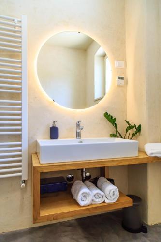 a bathroom with a sink and a mirror at Holiday Home Mikula in Krnica