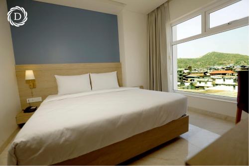 Ένα ή περισσότερα κρεβάτια σε δωμάτιο στο Hotel Daani Continental