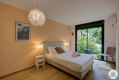 Postel nebo postele na pokoji v ubytování Villa Paloma 4 étoiles avec Piscine et Vue exceptionnelle sur l'ocean à Saint-Leu
