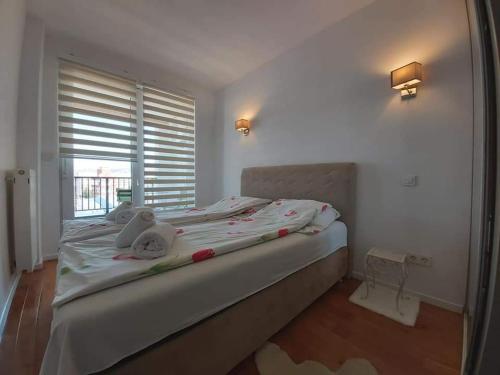 Ένα ή περισσότερα κρεβάτια σε δωμάτιο στο Amir Apartman Stup-Ilidža