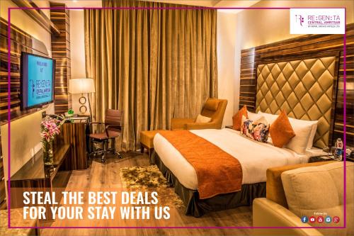 a hotel room with a bed and a television at Regenta Central Amritsar in Amritsar