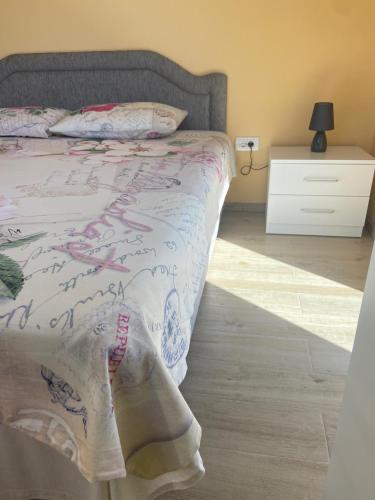 a bedroom with a bed with a white dresser and a bed sidx sidx sidx at Apartments Kapisoda in Cetinje