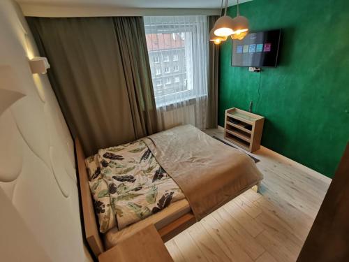 Кровать или кровати в номере Apartament Strzyza Castle - Definicja Luksusu