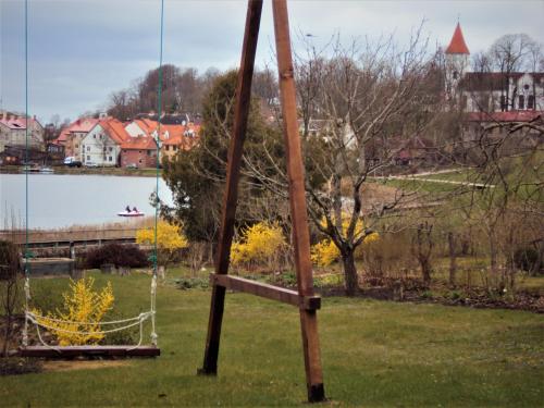 a wooden pole with a net in a field at Saule in Talsi