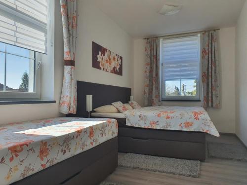 Postel nebo postele na pokoji v ubytování Apartmá na Hané