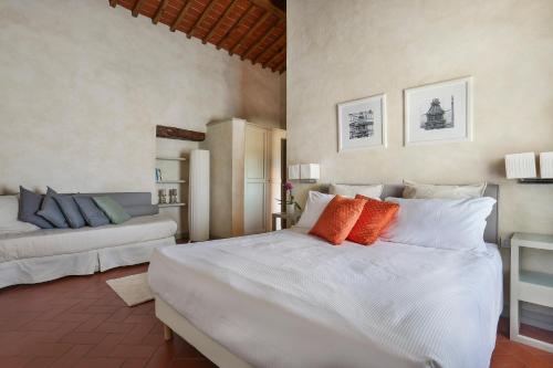 En eller flere senge i et værelse på Borgo Iesolana