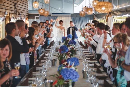 a bride and groom walking down the aisle at their wedding at Hotel Frigopan in Plovdiv