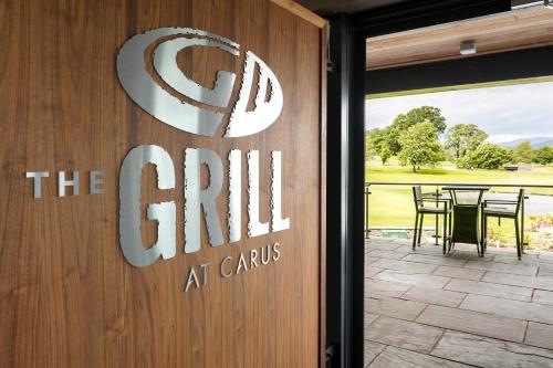 a sign that reads the grill at carts on a door at The Lodge @ Carus Green in Kendal