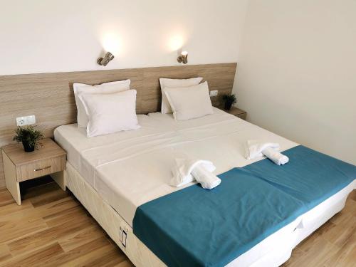 Ένα ή περισσότερα κρεβάτια σε δωμάτιο στο Hotel Largo Beach