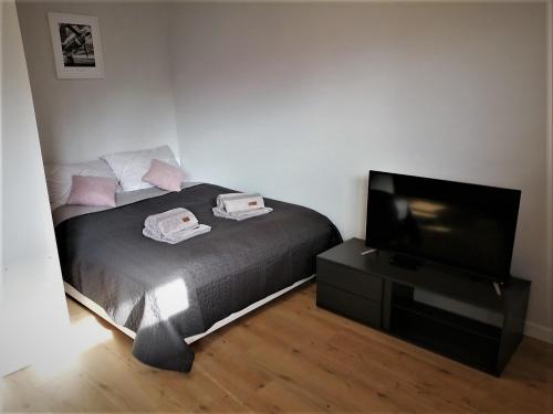 Posteľ alebo postele v izbe v ubytovaní Apartament nad morzem KOŁO BRZEGU