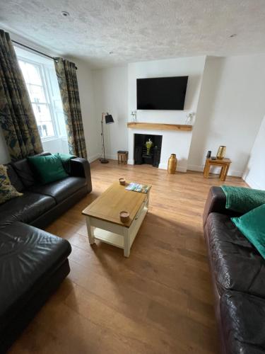 a living room with a couch and a coffee table at Low Haven in Keswick