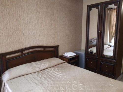 Кровать или кровати в номере Гостиница Нормандия