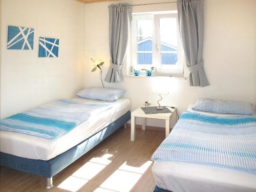 Ένα ή περισσότερα κρεβάτια σε δωμάτιο στο Holiday Home Sanddorn by Interhome