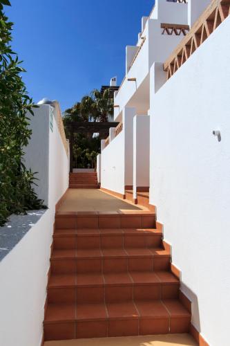 a set of stairs leading up to a house at Hostal El Dorado in San José