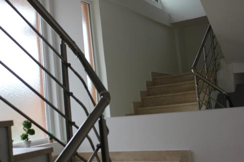 a staircase in a house with a window at Apartments Kapisoda in Cetinje