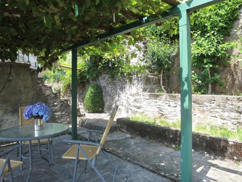 a patio with a table and chairs under a pergola at Holiday Home Monte Tabor by Interhome in Carmine