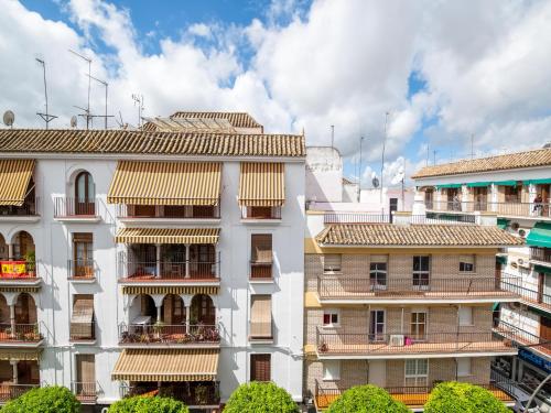 an apartment building with balconies and condos at Apartamentos Santiago in Écija