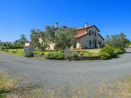 a house sitting on the side of a road at Apartment Le Macine-2 by Interhome in Cecina