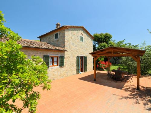 a patio with a gazebo in front of a building at Holiday Home Lucia by Interhome in Cortona