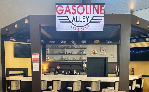 a restaurant with a sign for a cuisine ally at Holiday Inn Morgantown - Reading Area by IHG in Morgantown
